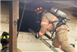 Firefighter Climbing Window