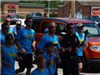 Police Officer in Parade Running with Group of People
